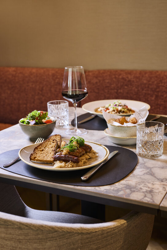 NH Collection Nurnberg City Restaurant dinner setup dish wine